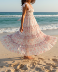White floral ruffle maxi dress - beach front view twirling